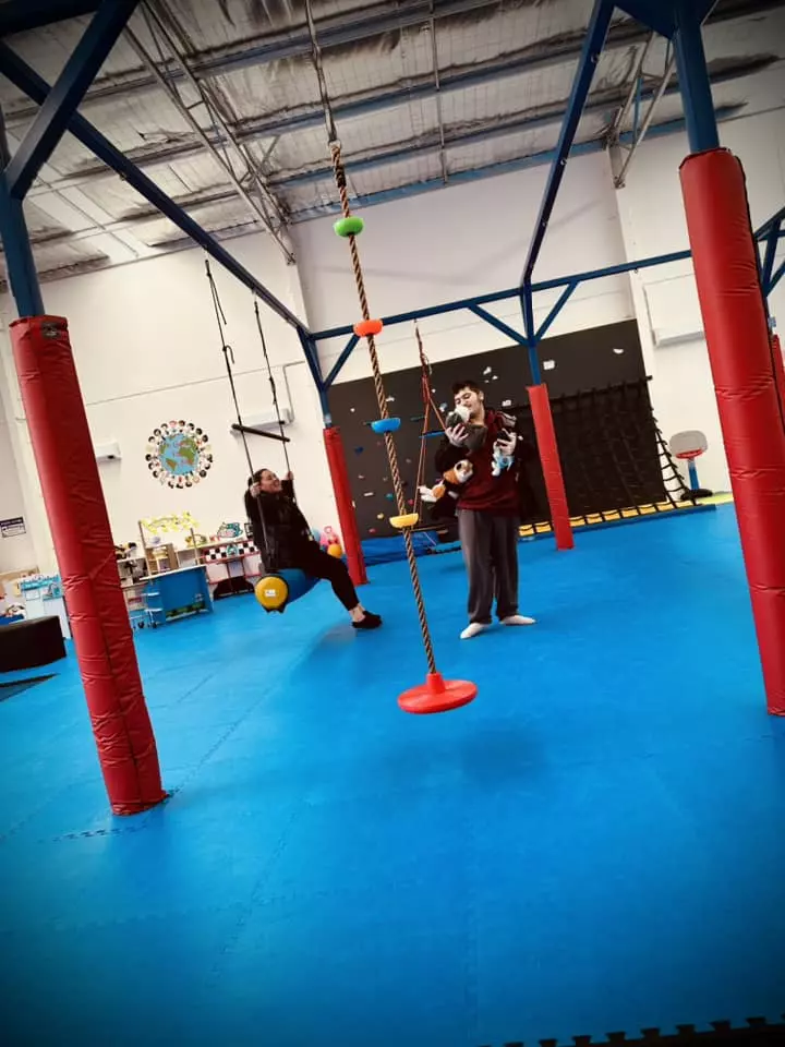 Disabled boy having fun at indoor play centre
